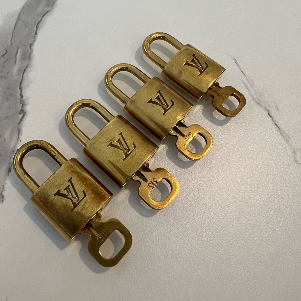 SOLD!! Authentic LV keys. Numbers 316, 313, 307, and 306. Selling as a set of 4.